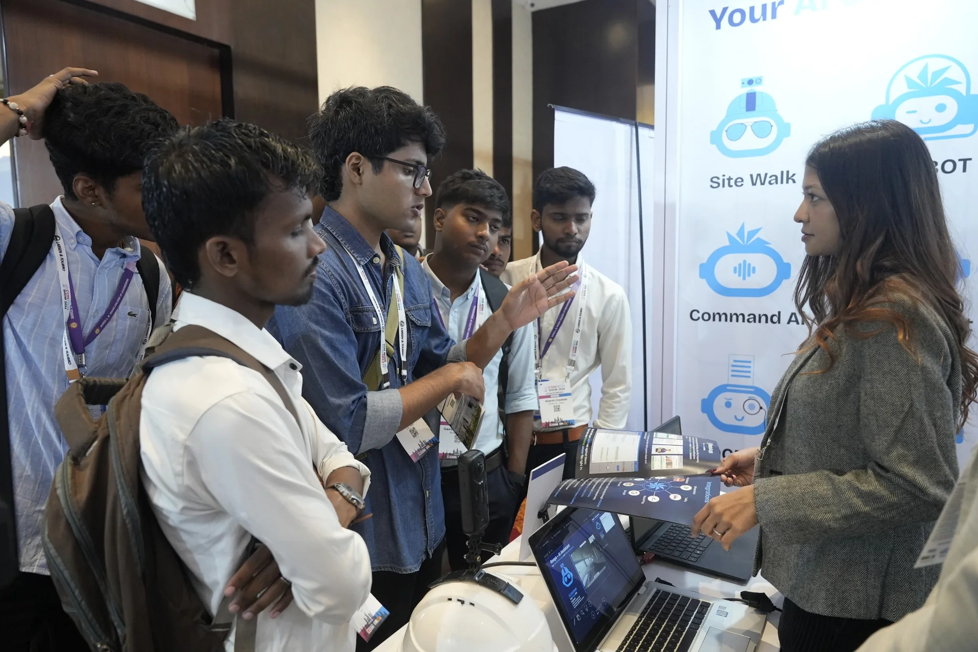 Visitors discussing Aasaan AI construction solutions with a team representative at Aasaan Booth A15 during Construction Technology Show 2026